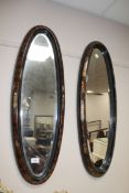 A pair of oval walnut chinoiserie bevelled mirrors CONDITION REPORT: Each measures