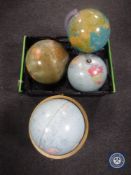 Four assorted globes with stands