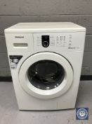 A Samsung washer together with a microwave