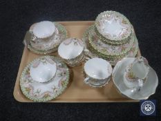 A tray containing a twenty-one piece Victorian Staffordshire bone china tea service