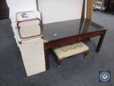 A mahogany glass topped curio coffee table together with a linen box,