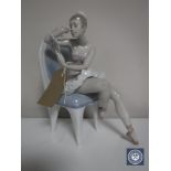 A Lladro figure of a ballerina seated on a chair holding a mirror CONDITION REPORT: