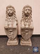 A pair of composition garden heraldic lions,