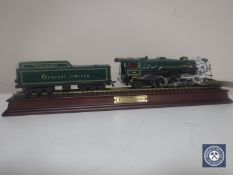 A Crescent Limited steam train and wagon on wooden stand