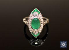 An 18ct white gold emerald and diamond ring,