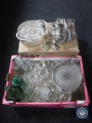 Two boxes containing assorted glass ware together with plated trays and candlesticks