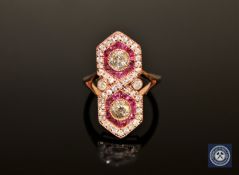 A 14ct rose gold ruby and diamond ring, with two brilliant-cut diamonds totalling 0.