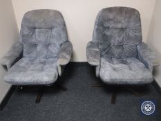 A pair of late 20th century swivel armchairs