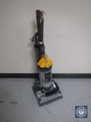 A Dyson DC33 upright vacuum cleaner