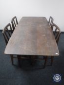 A mid 20th century teak dining table together with four chairs