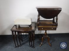 A nest of three inlaid mahogany glass topped tables together with an oak drop leaf coffee table,
