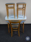 A mid 20th century drop leaf Formica topped kitchen table together with a chair and two stools