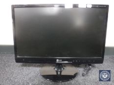 An LG Flat Tron M2280D LED TV monitor with remote