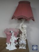 A large chalk cherub table lamp together with a pottery table lamp depicting four doves on a tree