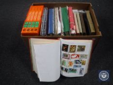A box containing large quantity of assorted stamps,