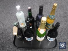 A tray containing eight assorted bottles of alcohol including Schnapps, Babycham,