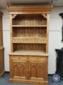 A Gothic style carved pine bookcase,