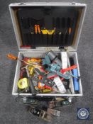 An aluminium case containing assorted hand tools, vintage woodworking planes, precision measure,