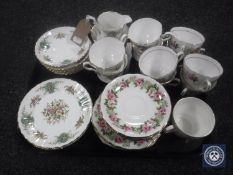 A tray containing eighteen pieces of Royal Stafford True Love china together with a Colclough china