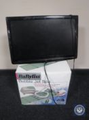 A boxed Babyliss spa together with a 21" LCD TV DVD
