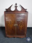 A Victorian inlaid mahogany wall cabinet