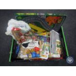 A box containing 20th century children's toys including jigsaw puzzles,