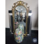 An ornate gilt framed hall mirror together with a contemporary framed print,