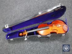 A 3/4 size violin in case with bow