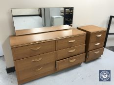 A teak effect six drawer dressing chest together with matching three drawer chest