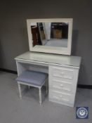 A contemporary white dressing table with stool together with three two-drawer matching bedside