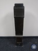 A metal Art Deco floor heater