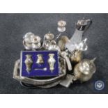 A tray of silver plated items, glass claret jug,