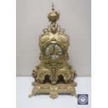 An ornate 19th century style gilt brass mantel clock