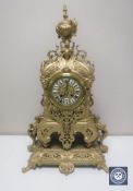 An ornate 19th century style gilt brass mantel clock