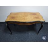 A shaped Kingwood coffee table with gilt metal mounts