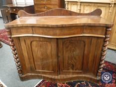 An early Victorian mahogany serpentine front chiffonier,