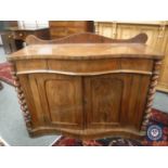 An early Victorian mahogany serpentine front chiffonier,