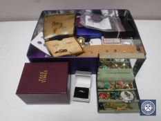 A box of costume jewellery, yellow metal ring, earrings etc.