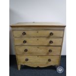 An antique pine four drawer chest