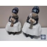 A pair of Royal Copenhagen figures of girls knitting,