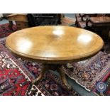 A Victorian walnut oval pedestal breakfast table with inlaid top,