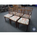 A set of six late 20th century teak rail back dining chairs