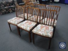 A set of six late 20th century teak rail back dining chairs