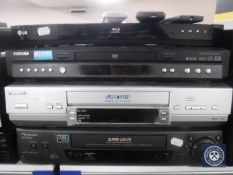 An LG Blu-ray player together with two Panasonic video players and a Toshiba DVD player