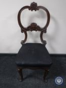 An antique mahogany dining chair