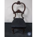 An antique mahogany dining chair