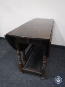 A Victorian oak gateleg table fitted a drawer