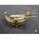 A collection of brass fire companion items,