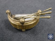 A collection of brass fire companion items,