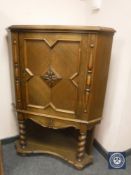 A period style carved oak corner cabinet,